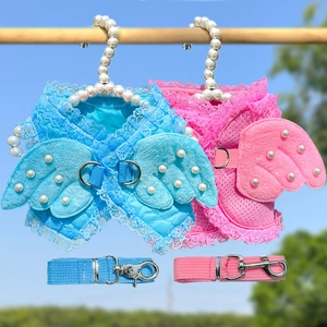 Detail of breathable lace pet harness with angel wings and pearls for dogs and cats