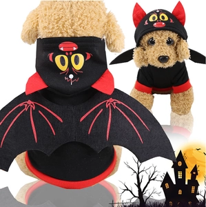 Detail view of pet Halloween costume with red monster hood and black bat wings