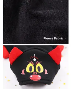 Close-up of thick fleece fabric detail on a festive pet hoodie with cartoon devil design