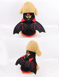 Pet Halloween costume featuring black bat wings and vampire hoodie on a small dog