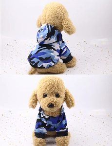 Detail view of blue camo pet hoodie with ribbed cuffs and stylish hood on model