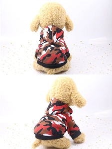 Detail of camouflage pet hoodie featuring red patterns and black ribbed cuffs on soft cotton