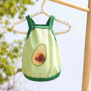 Breathable green mesh pet vest with avocado print hanging on a pearl hanger outdoors