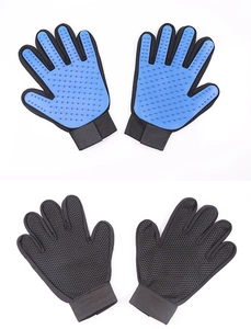 Detail of pet grooming glove showing blue silicone bristles and breathable mesh