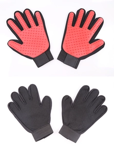 Detail view of pet grooming glove with red silicone nodes and breathable black mesh fabric