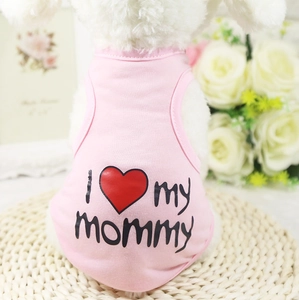 Pink I Love My Mommy pet vest on small white dog with floral decor background
