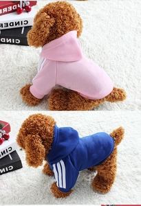 Detail of pet hoodies with ribbed cuffs and white stripes in pink and dark blue