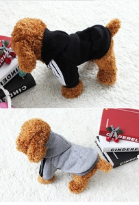 Close-up of sporty pet hoodies featuring iconic striped sleeves and ribbed cuffs on soft fabric