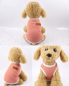 Detail of orange and white striped pet vest with a brown leather CLASSIC patch