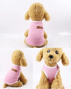 Detail view of pink and white striped cotton pet vest with a brown leather classic label