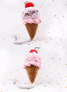 Detail eines rosa Eis-Plüschtiers für Haustiere mit Stickereien und gewebtem Baumwollseil