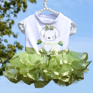 Detail of pet summer dress with cartoon print, green mesh tutu and bow on a pearl hanger