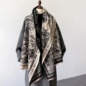 Vintage letter print cashmere shawl with fringe detail on a grey wool winter coat