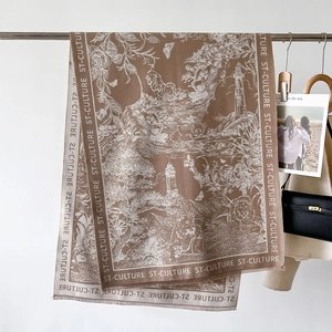 Close-up of vintage scarf texture with lion landscape print and soft tassel edges