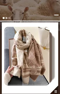 Detail of khaki plaid cashmere scarf showing soft knitted texture and fringe edges