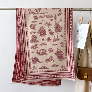 Detail of vintage paisley shawl with nautical illustrations hanging in lifestyle setting