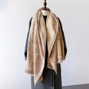 Two-tone cashmere-like knit scarf with bamboo leaf patterns and soft fringe tassels