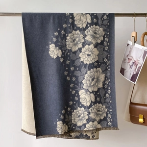Detail of vintage flower jacquard shawl with double-sided design and tassel edges