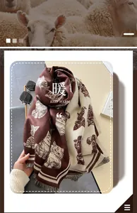 Detail of cute cat jacquard pattern on a warm, thick faux cashmere scarf with fringe