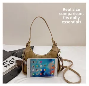 Beige woven handbag size comparison with tablet and daily essentials for scale