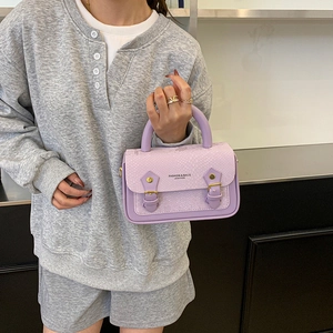 Chic light purple snake pattern handbag with dual straps and elegant top handle for women