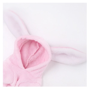 Detailed view of pink coral fleece pet hoodie with long plush rabbit ears and white lining