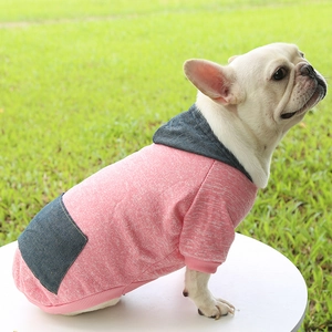 Pink and navy hooded pet sweatshirt with pocket detail worn by a French Bulldog