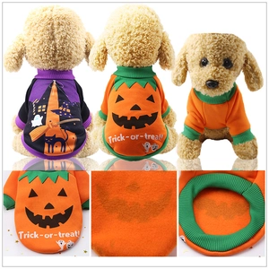 Detail view of Halloween pet hoodie featuring pumpkin prints and fleece fabric texture