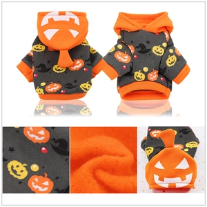 Detailed view of Halloween pet hoodie with thick orange fleece lining and pumpkin prints