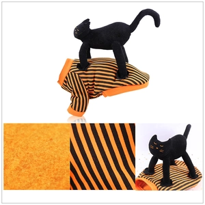 Detailed macro shot of orange and black striped fleece pet sweatshirt for Halloween