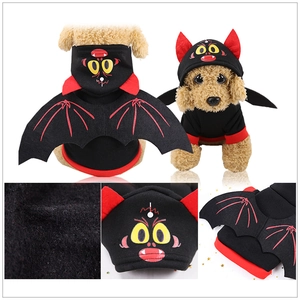 Detail of bat wings and devil horn hood on black fleece pet costume for Halloween