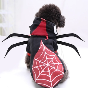 Rear view of a black poodle wearing a spider costume with red web and plush legs