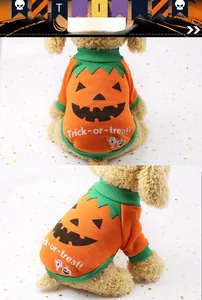Detail of orange Halloween pumpkin pet sweater with green ribbed collar and festive print