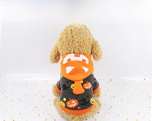 Detail of Halloween pet hoodie featuring orange pumpkin and wizard hat patterns on soft fleece