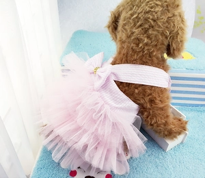 Detailed view of pink striped pet dress featuring layered lace tulle and bow decoration