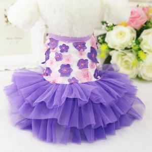 Close-up of three-layer purple mesh tutu and 3D floral appliqués on a pet dress