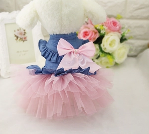 Detail of dog princess dress with denim top, pink mesh tutu and pearl bow decoration