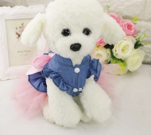 Detail of pet dress with blue denim top, pink mesh tutu and large satin bow decoration