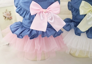 Detail of pet princess dress with denim bodice, mesh skirt, and pearl ribbon bow