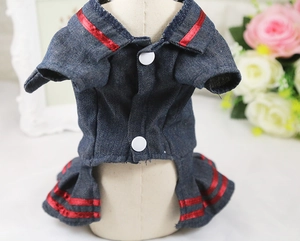Macro detail of navy denim pet dress with striped nautical collar and white buttons