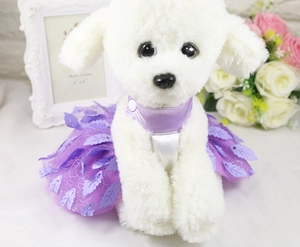 Detail of purple pet tutu dress with leaf sequins and snap closure on a white dog model