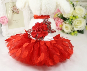 Detail of red pet dress with sequined leaves and velvet flower for dogs and cats