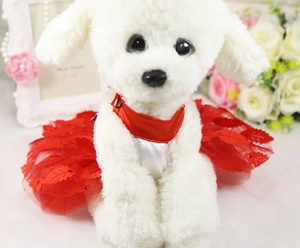 Detail of red mesh pet wedding dress with leaf appliques on a plush dog model