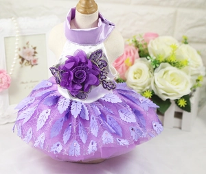 Detail of purple pet dress with oversized 3D flower and layered sequin mesh skirt