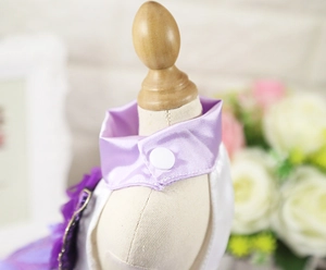 Detail of purple satin pet dress collar with snap button and mesh flower trim