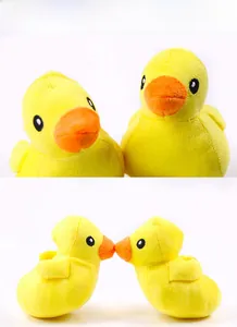 Close-up of yellow plush duck pet toys featuring orange beaks and soft squeaky material