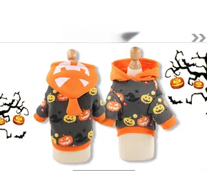 Detail of Halloween pumpkin hoodie for pets with orange trim and festive patterns