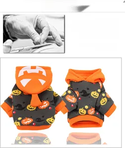 Detail of fleece pumpkin pet hoodie showing 3D tailoring and soft inner material