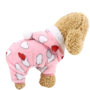 Close-up of pink heart pattern flannel pet pajamas with white plush pompom and ribbed cuffs