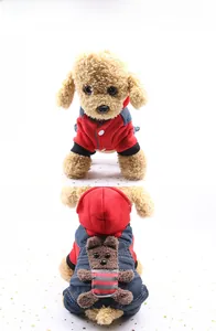 Detail of dog overall outfit with blue denim straps and a 3D plush bear on the back